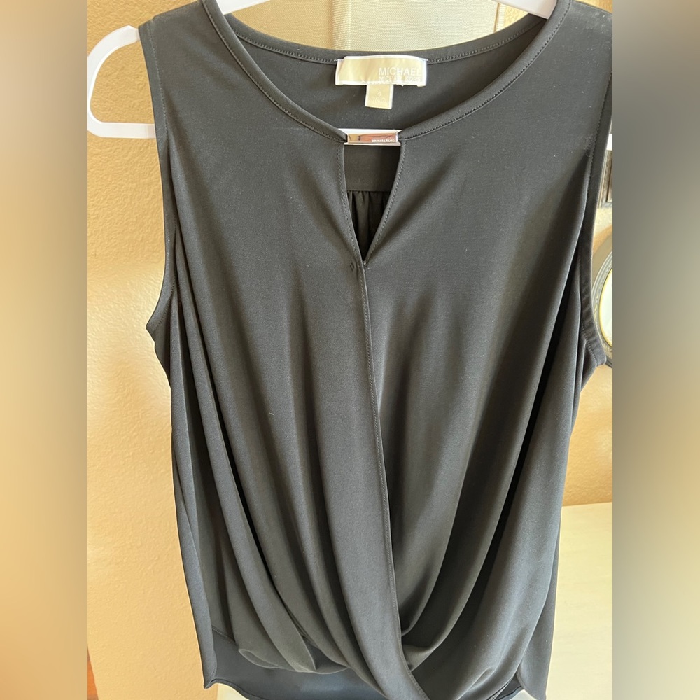 Michael Kors black blouse with peek a boo front.